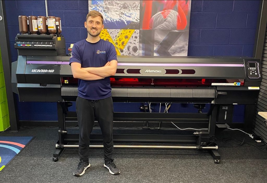 Origin Sign Co Digital Print Manager, Joe Clark with the company's Mimaki UCJV300-160 UV printer/cutter