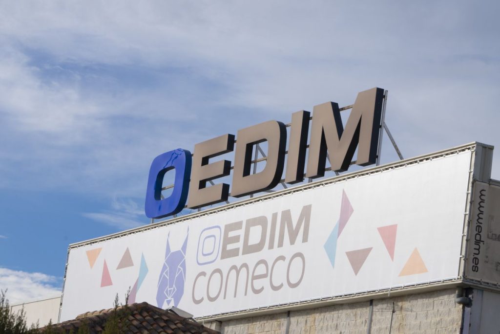 Oedim logo on top of building